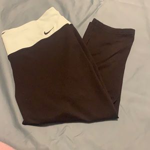 Nike Dri-fit Black capris with light blue band. Size large